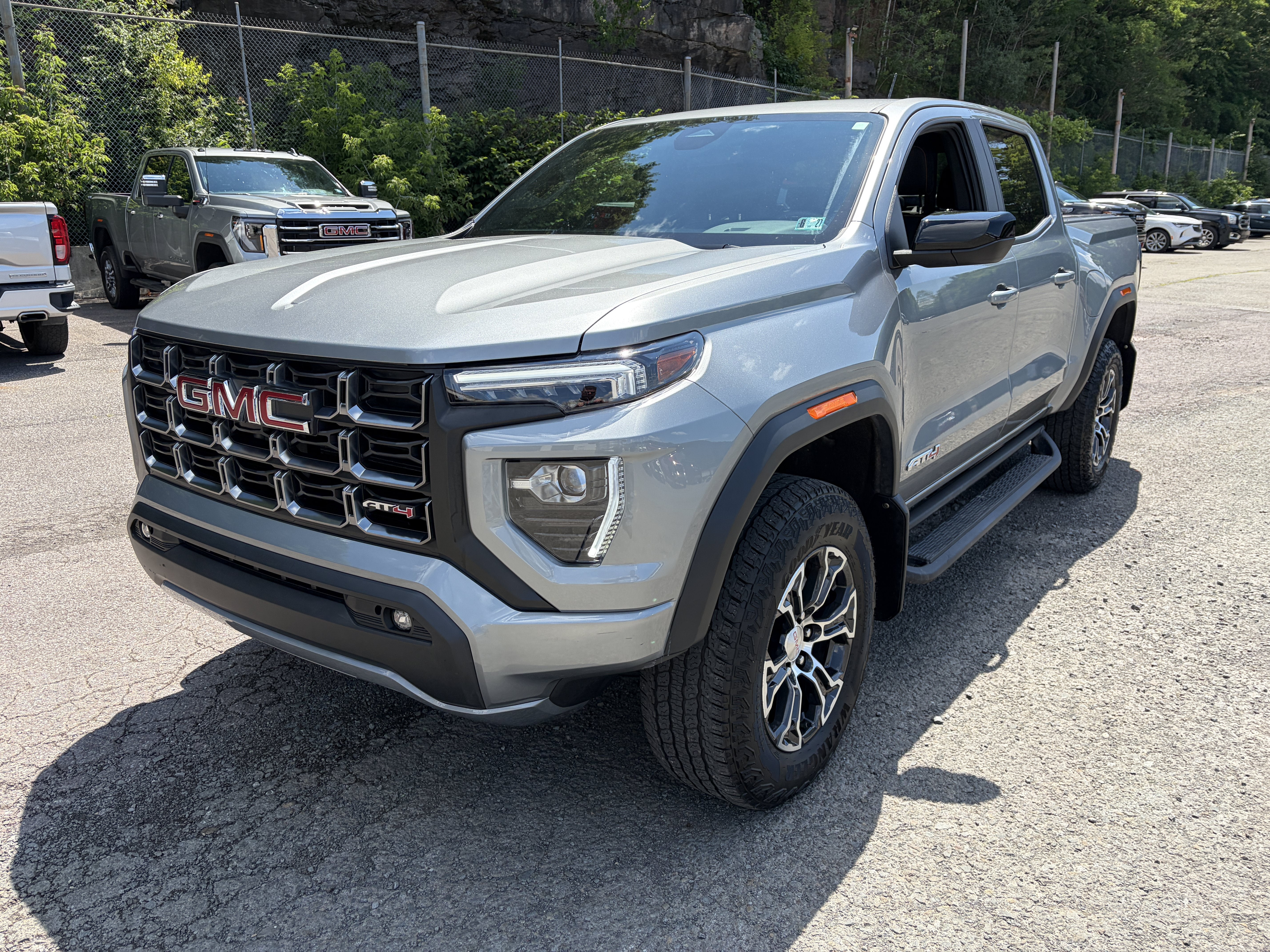 2024 GMC Canyon AT4 in Sterling Metallic — front three-quarter view
