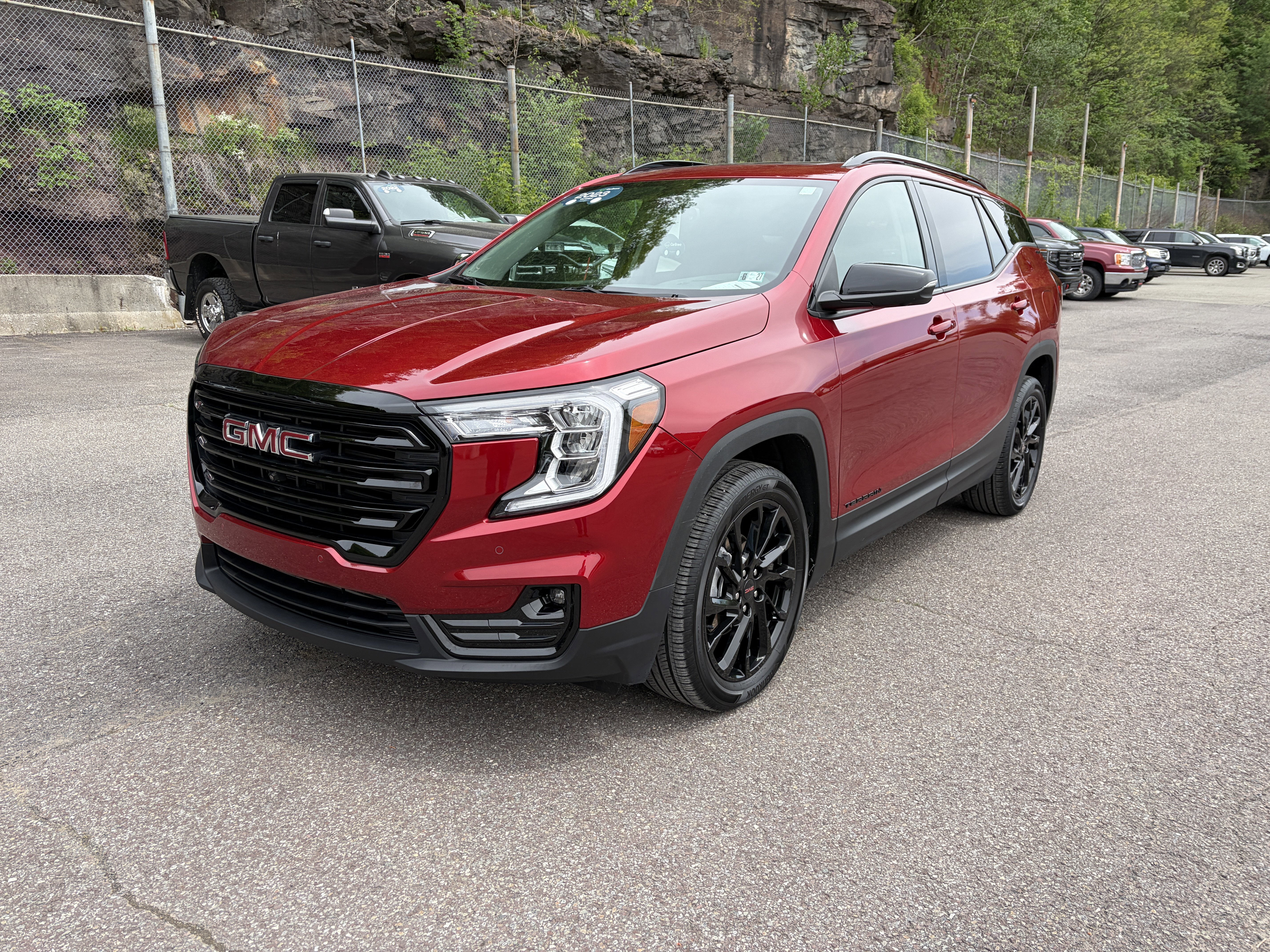 2023 GMC Terrain SLT in Volcanic Red Tintcoat — front three-quarter view